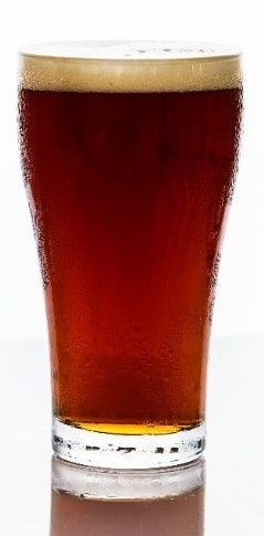 A glass of beer on a table

Description automatically generated