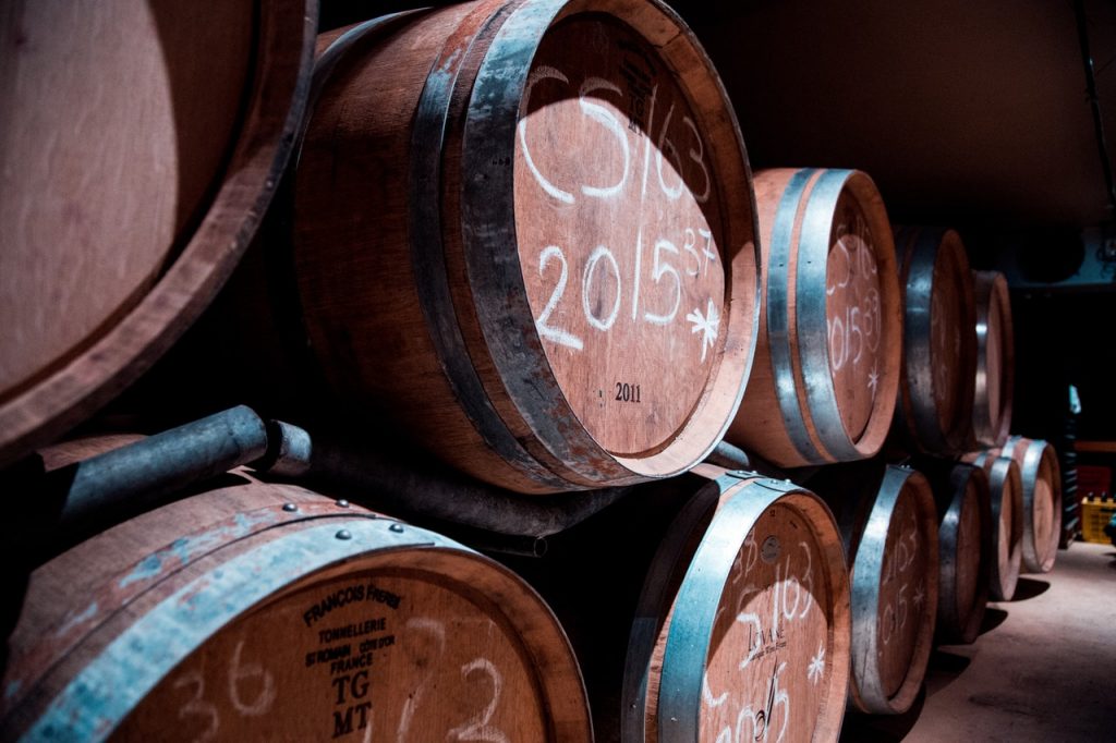 wooden barrels of dark beer